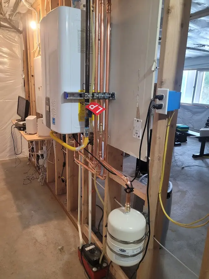 Licensed plumber repairing a kitchen sink in Esopus